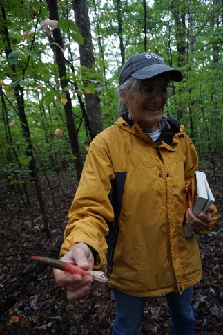 Peggy with an elegant stinkhorn. Photo by Chip Brown.